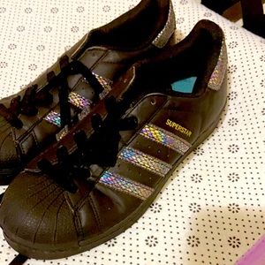 Sneakers used maybe once or twice All black with metallic strips.